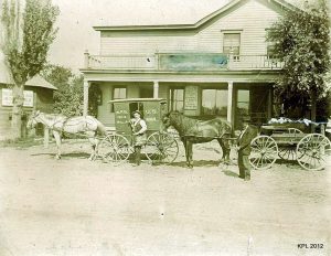 1. William Klumb made these mail carrier wagons in his shop. Beside the wagons are Fred and his Father, William Klumb who stated that the wagons were made for postal carriers Levi Hupert, John Kobussen and Ted Smits. Abt. late 1800s.